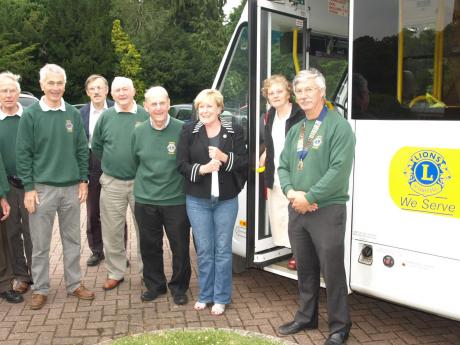Tring Lions Standing outside the newly painted bus.