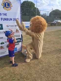 a young runner receiving his medal a young runner receiving his medal