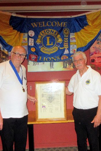 the outgoing president, Mick, hands over to the new president Martin the outgoing president, Mick, hands over to the new president Martin